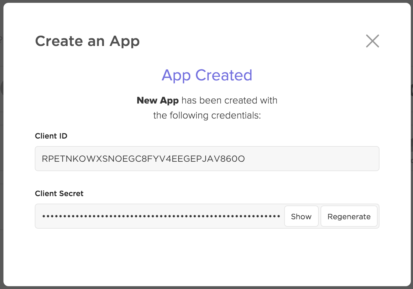 Screenshot showing the 'Create an App' modal with an example Client ID and Client Secret.